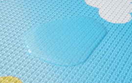Dwinguler playmat coated surface feature