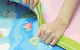 Dwinguler playmat thickness for safety feature