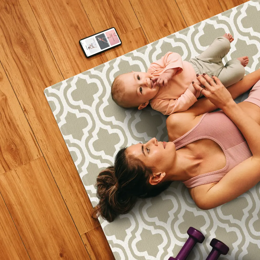 Mother and baby relaxing on a Dwinguler premium foam playmat