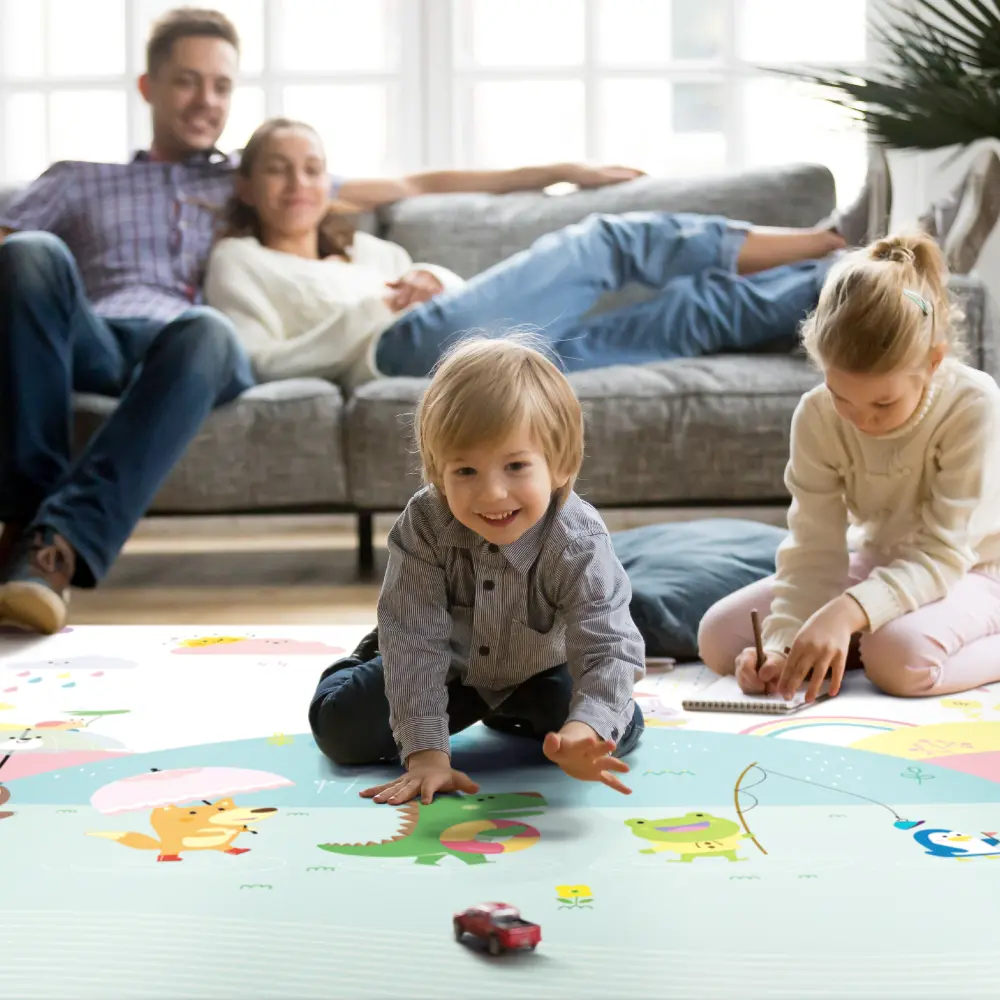 Children playing on a Dwinguler family playmat in the living room